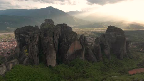 aerial reverse shot showcasing the spectacular landscape and geological wonders of "meteora" in thessaly, greece