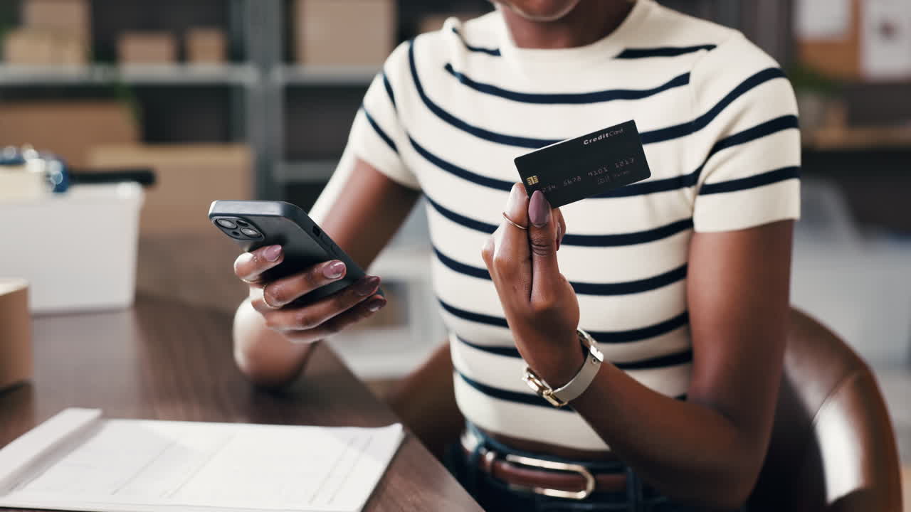 Woman Holding Smartphone and Credit Card for Online Payment