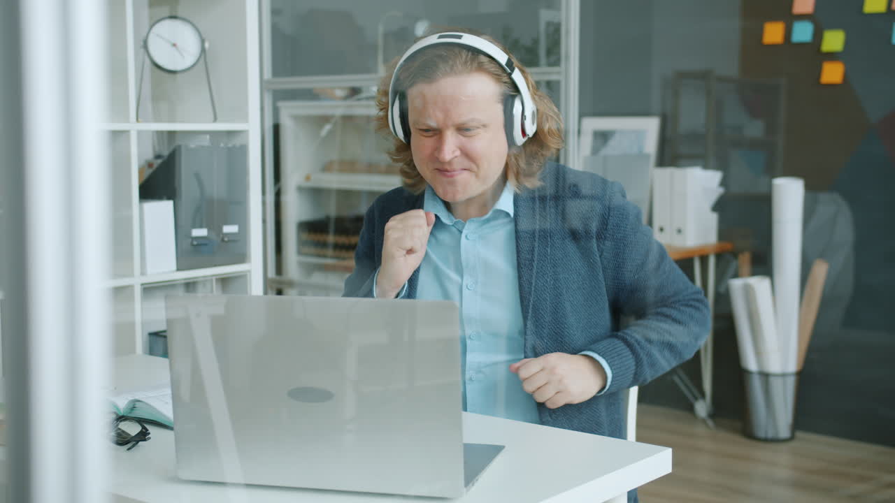 Man Working on Laptop in Office