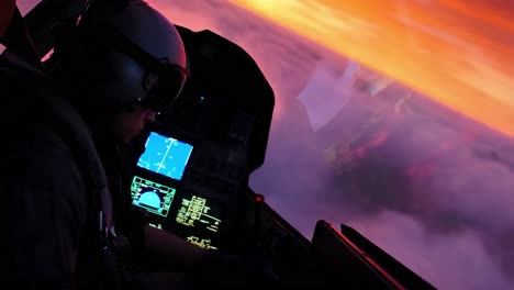 pilot in cockpit at sunrise/sunset