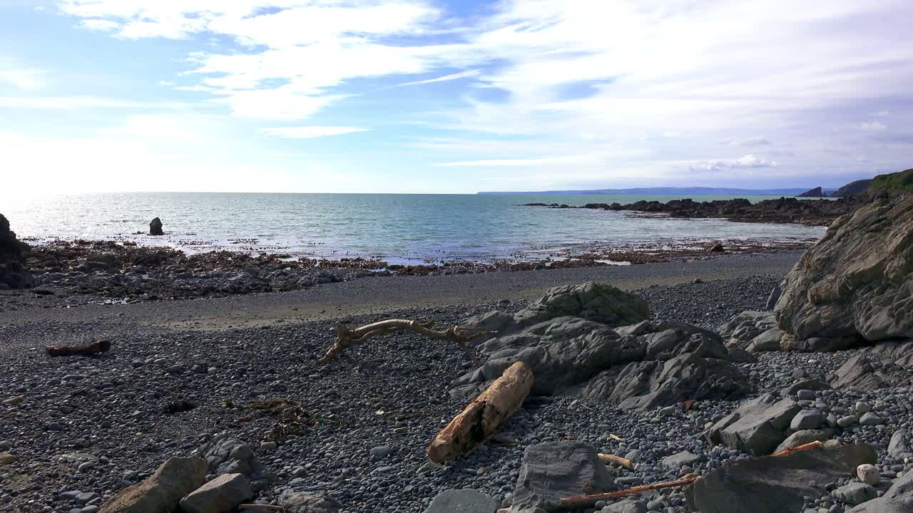 Ireland epic Locations deserted beach with driftwood and incoming tides Copper Coast Waterford Ireland beauty
