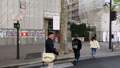 three people walking on parisian streets