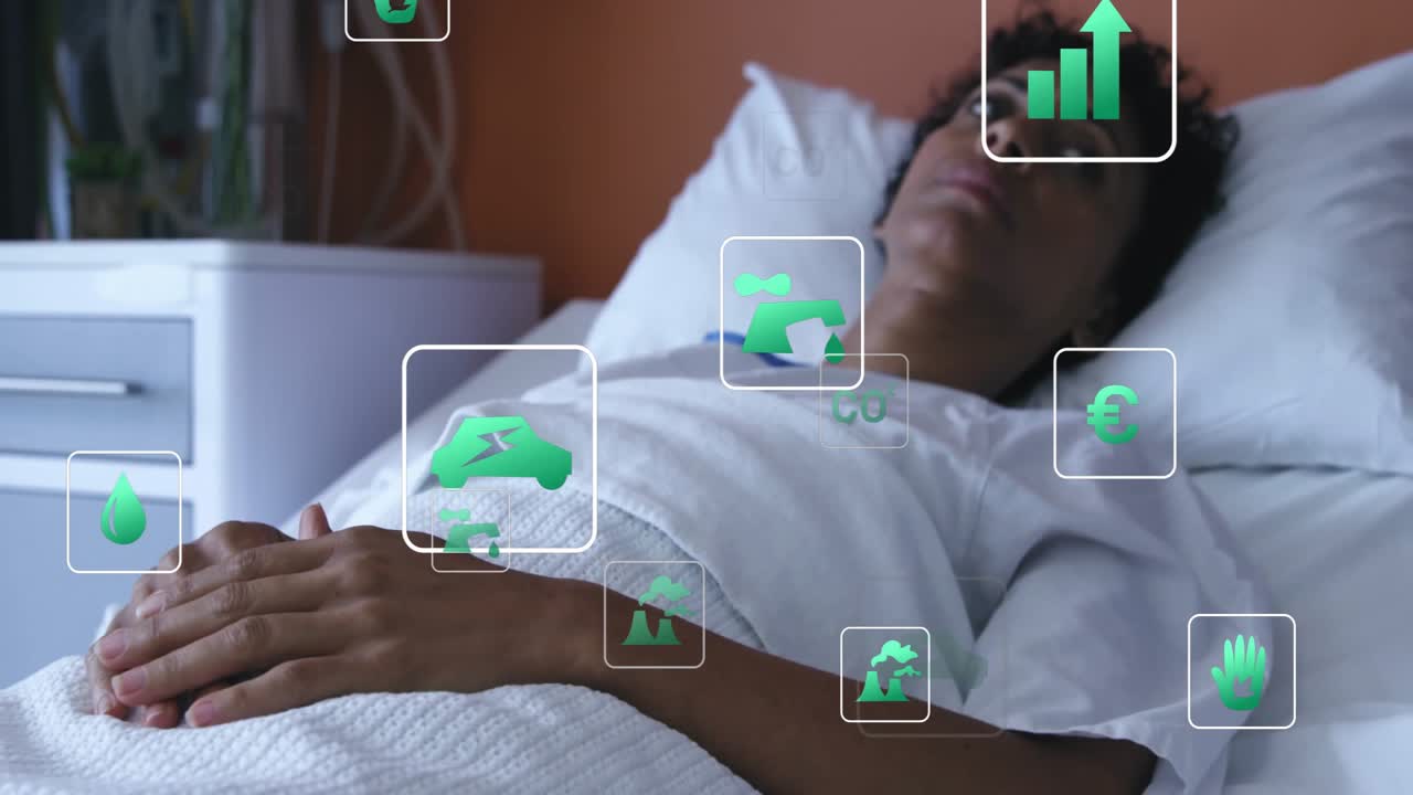 lying still in hospital bed activating green icons visualizing data drifting around head and chest