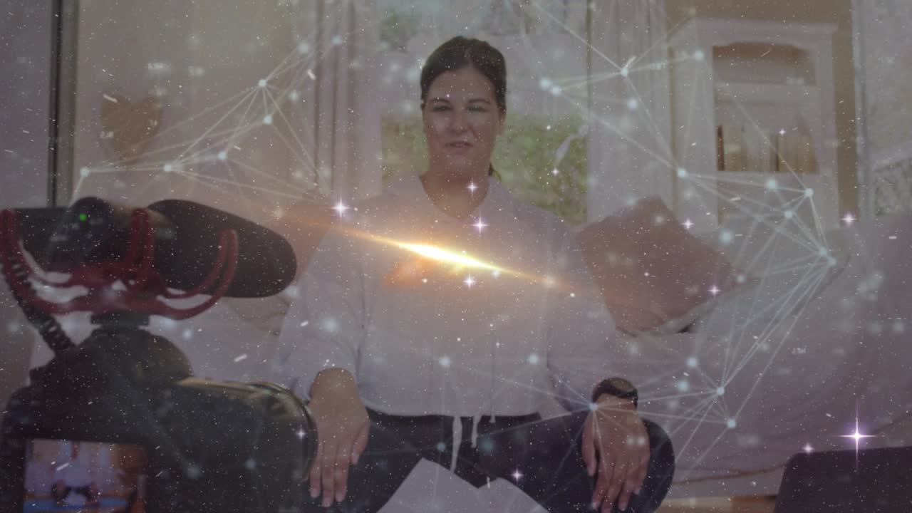 Animation de points lumineux sur une femme caucasienne réalisant un vlog