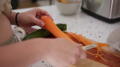 slicing carrot finely using universal peeler