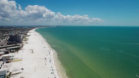 drone shot of the white sand beaches in fort myers, florida on a sunny day