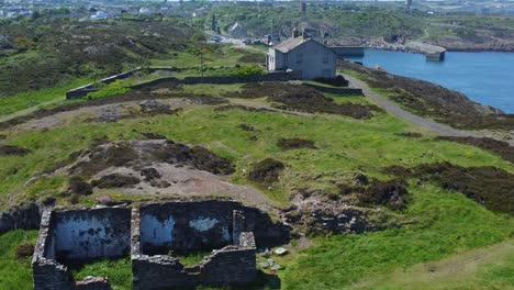 abandoned amlwch coastal countryside mountain house aerial view overlooking anglesey harbour lowering left