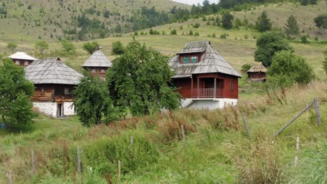 Ancient-Houses-At-Sopotnica-Village-On-Jadovnik-Mountain-In-Serbia---aerial-drone-shot