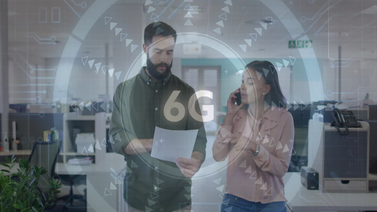 6G technology animation over colleagues discussing documents in modern office