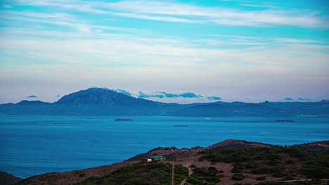 Container-ships-crossing-the-Strait-of-Gibraltar-as-seen-from-the-Spain-looking-across-at-Morocco---time-lapse