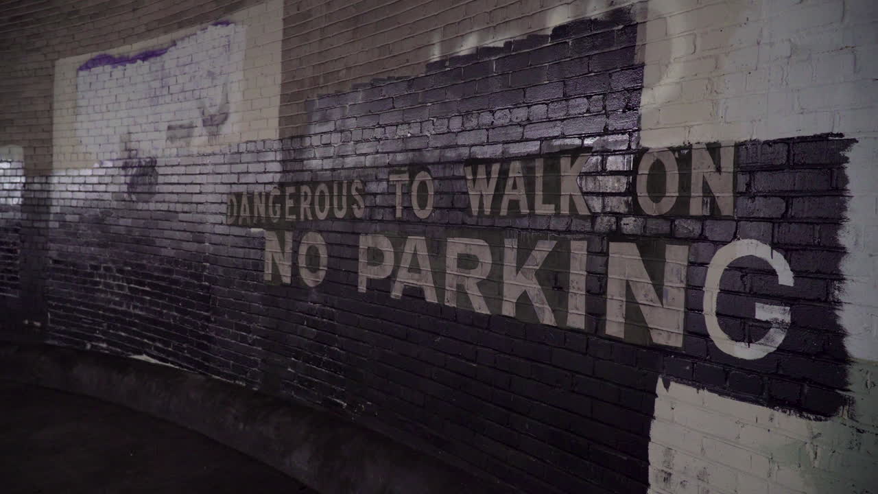 No parking sign in an abandoned warehouse