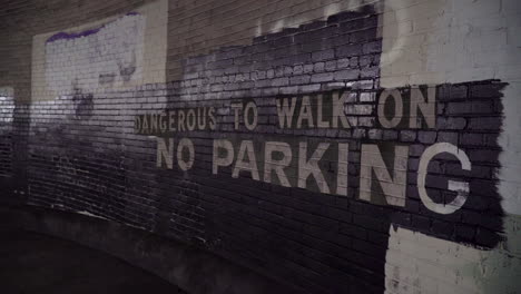 no parking sign in an abandoned warehouse
