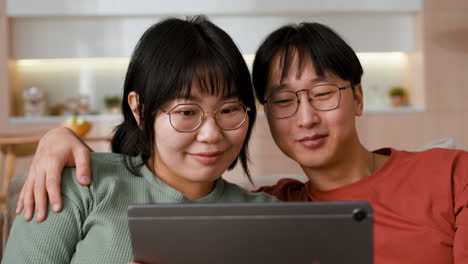 couple watching tablet