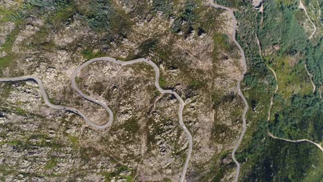 cars traveling in winding mountain road top view