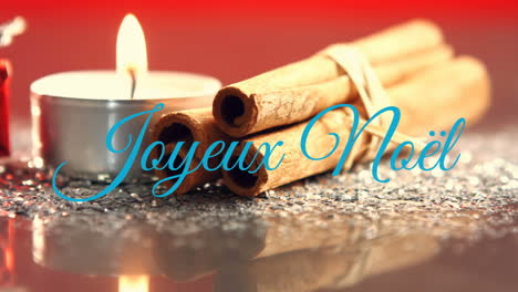 joyeux noã«l written over christmas candle