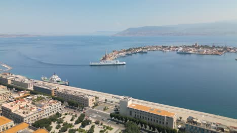 boat arrives in port of messina - beautiful aerial view