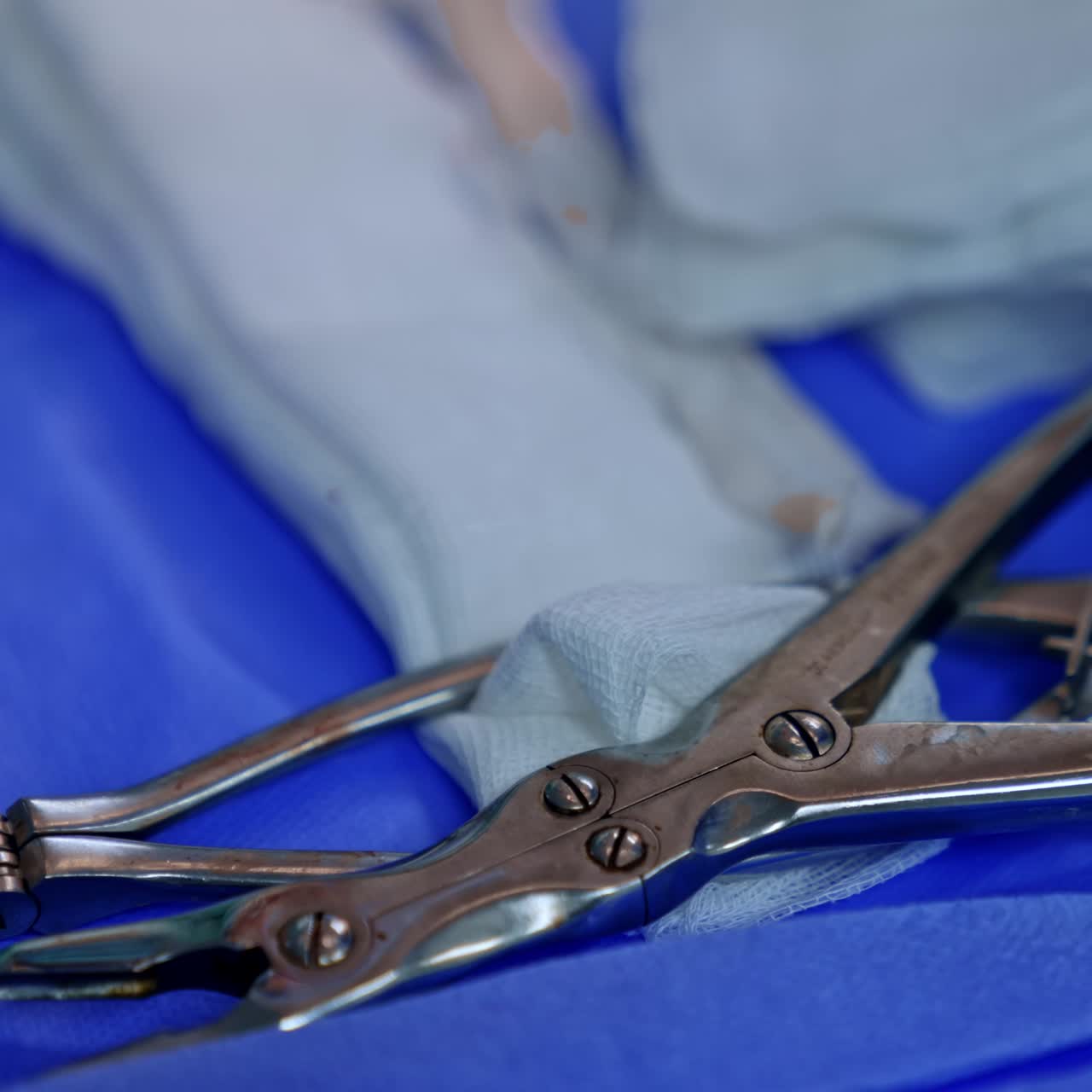 Metal medical instrument used in neurosurgical operations. Tools lying on the special table. Close up