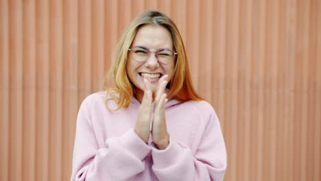 woman with glasses excited and happy