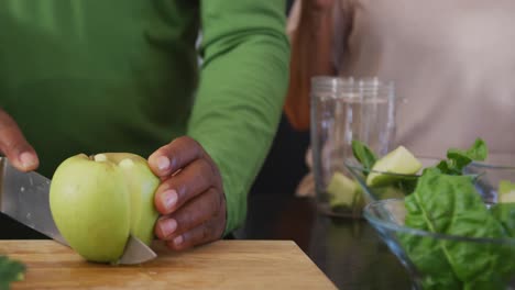 Senior-diverse-people-cooking-in-kitchen-at-retirement-home