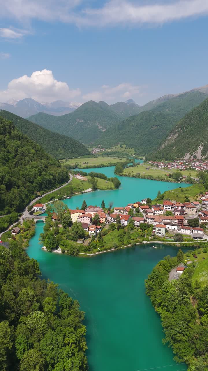 Turquoise Soca River With Charming Town Of Most Na Soci In Slovenia. aerial shot, vertical