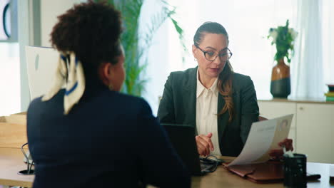 a businesswoman conducts a job interview