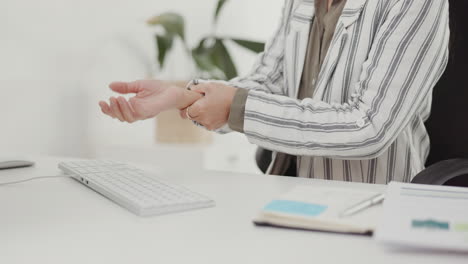 business woman, hands and wrist injury from carpal