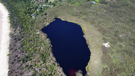 aerial view of a secluded lake near the coast