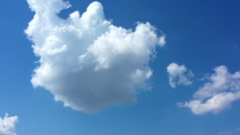 White-Fluffy-Clouds-In-Blue-Clear-Sky