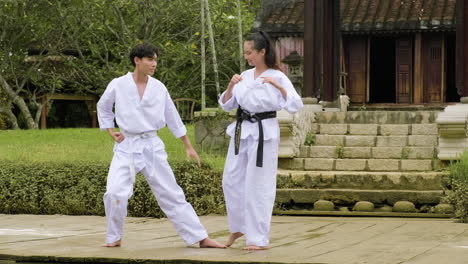 young couple fighting in class outdoors