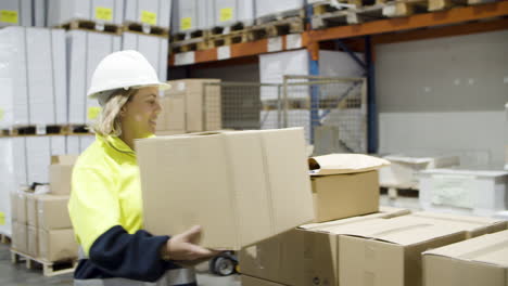 focused boss and female workers working in warehouse