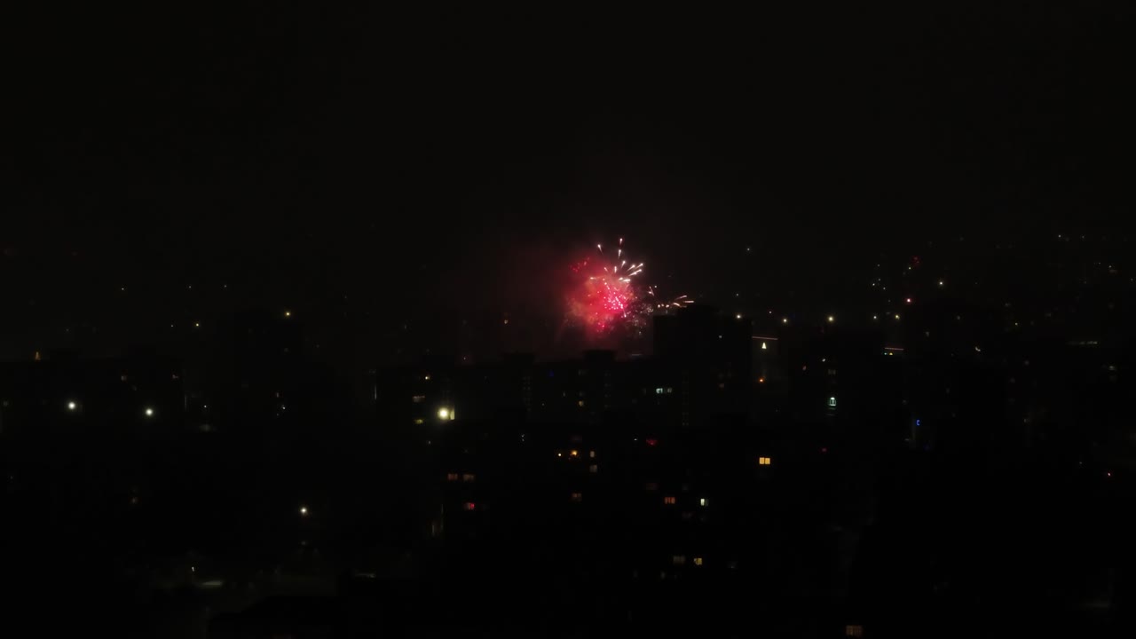 Fireworks sparkling in Kaunas city's dark sky. Static view