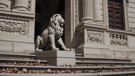 lion statue at the entrance of an ornate building