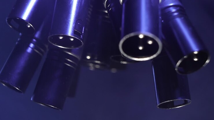 XLR cables hanging from a truss