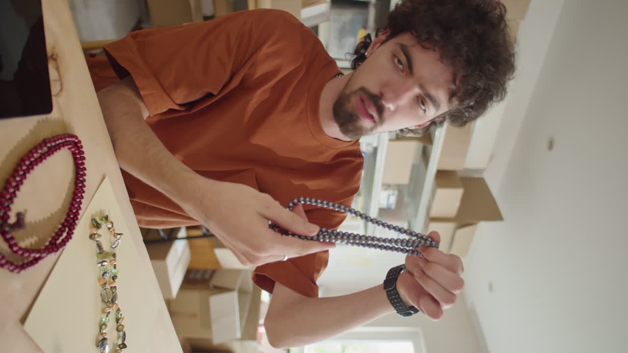 Male Blogger Filming Video Advertising of Jewelry