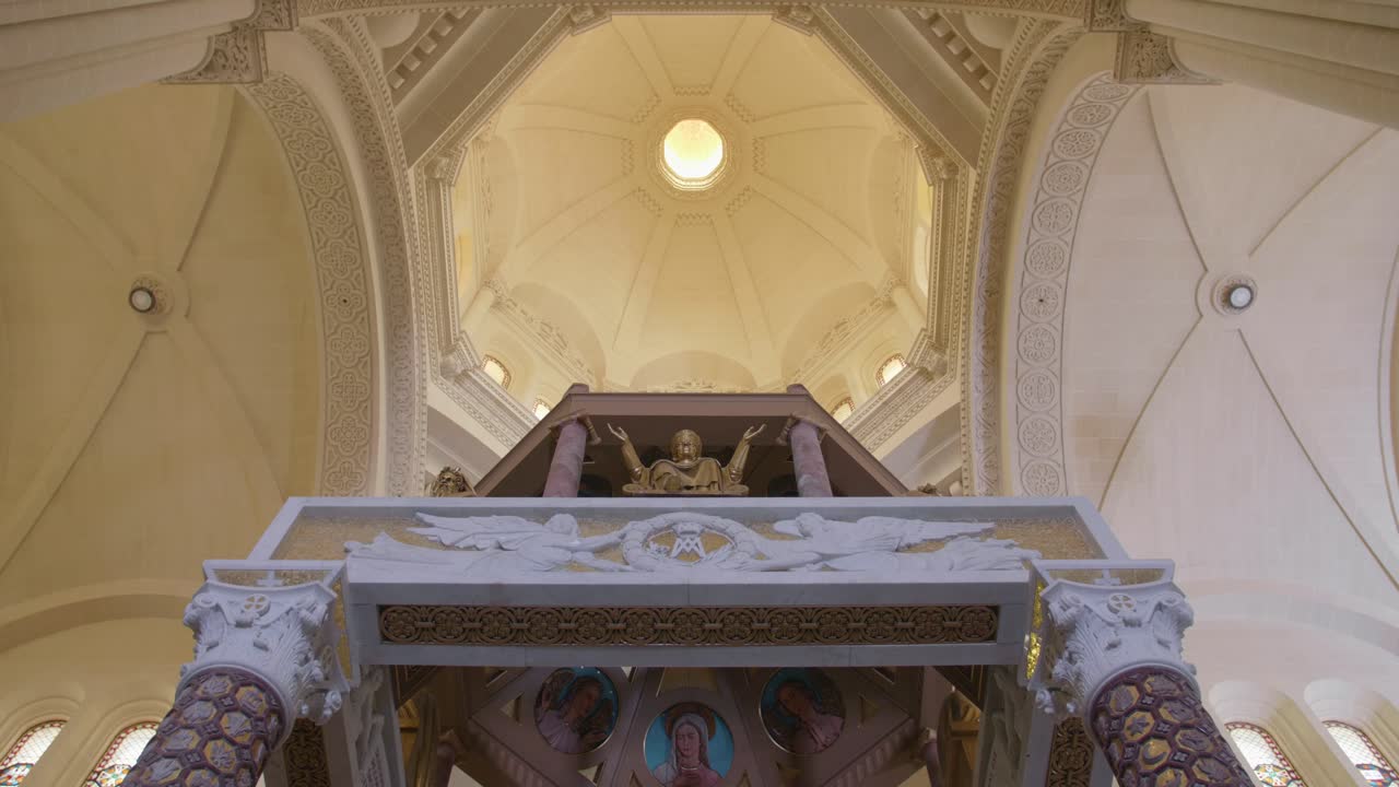 Interior view (low angle) of the dome of the Basilica of the Blessed Virgin Of Ta' Pinu on the island of Gozo, Malta.