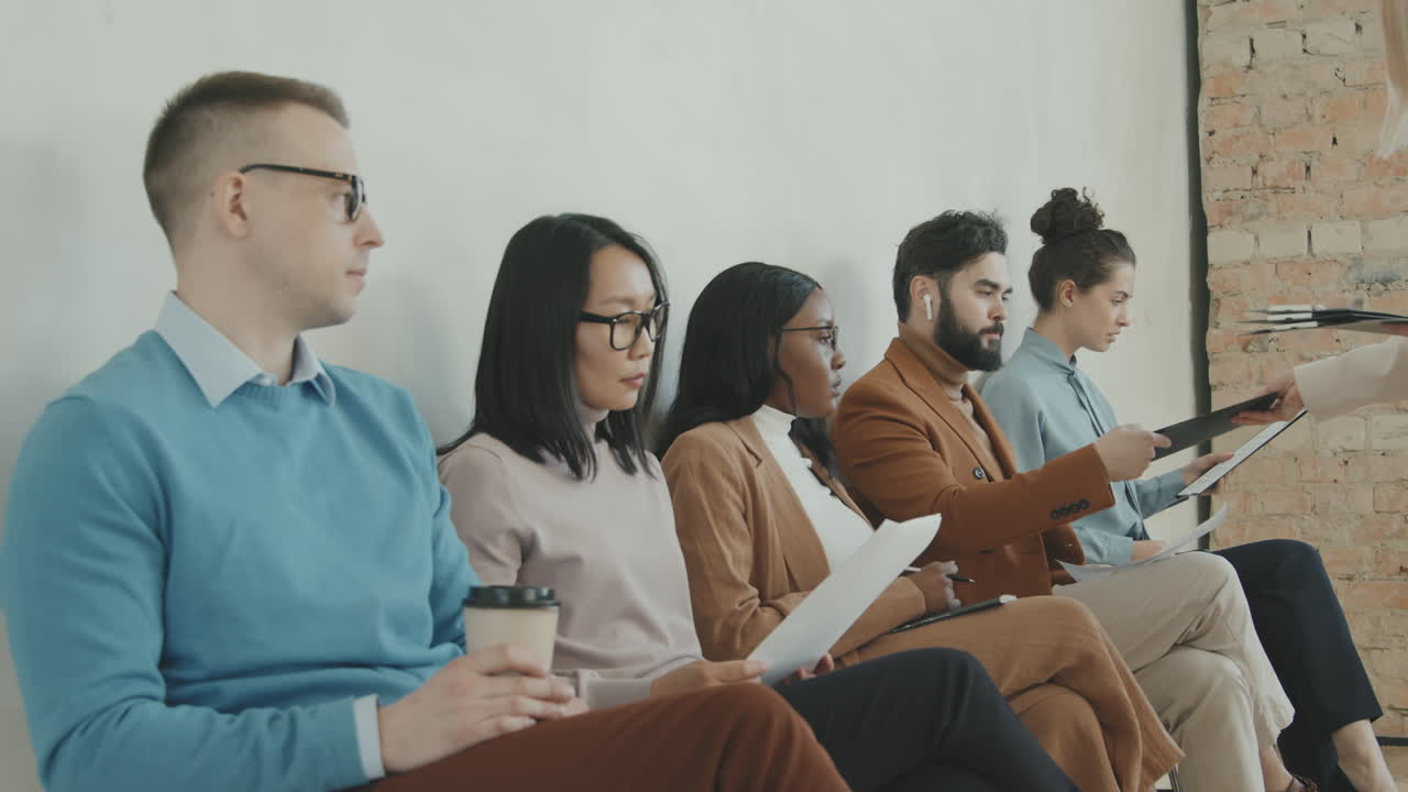 HR Manager Giving Forms to Applicants