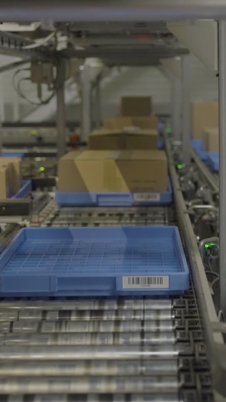 Cardboard boxes on conveyor belt in warehouse, logistics concept