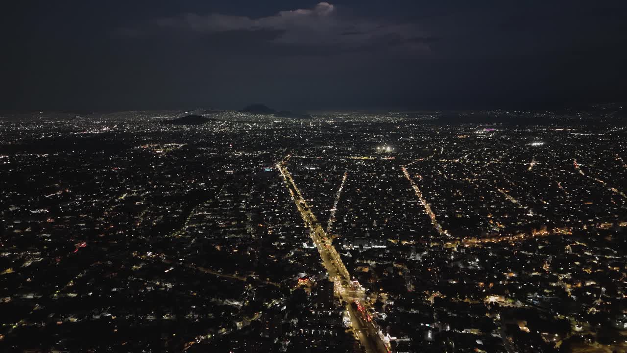 Mexico City on a stormy night from a drone