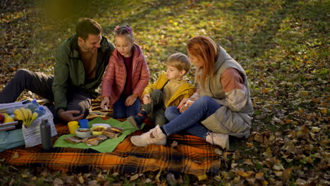 family picnic in the park during autumn