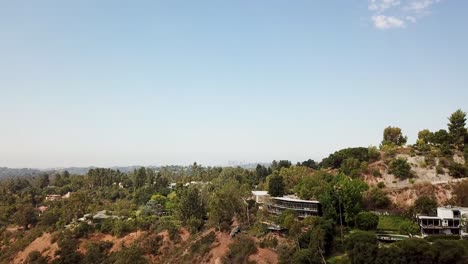 High class houses and villas with spectacular view on Los Angeles. Aerial view. Sunset time in Pasadena town suburbia. Green mountains in luxury neighborhood