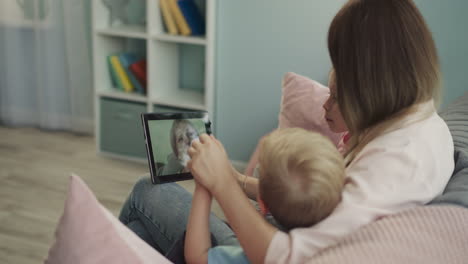 grandma talks to grandchildren and daughter on video call