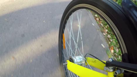 bicycle ride in summer time in the city.yellow bicycle ride in the city.