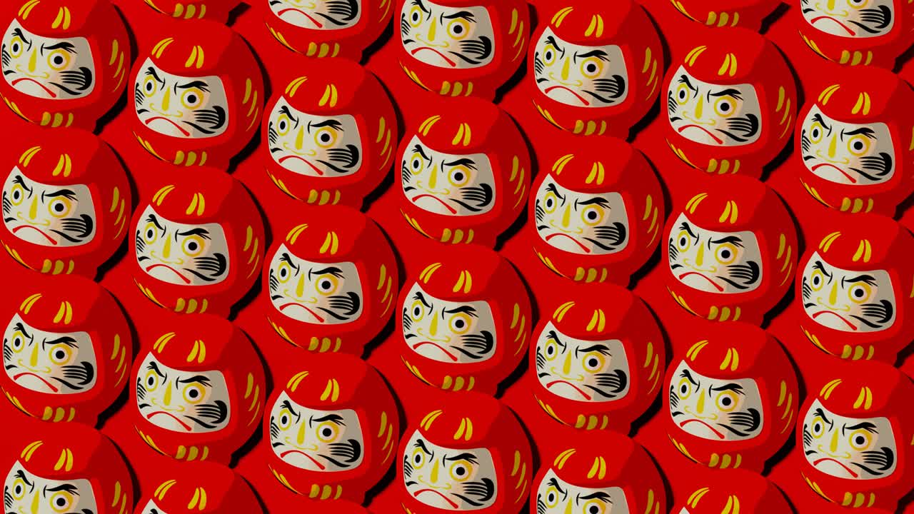muñecas rojas de daruma sobre un fondo rojo.