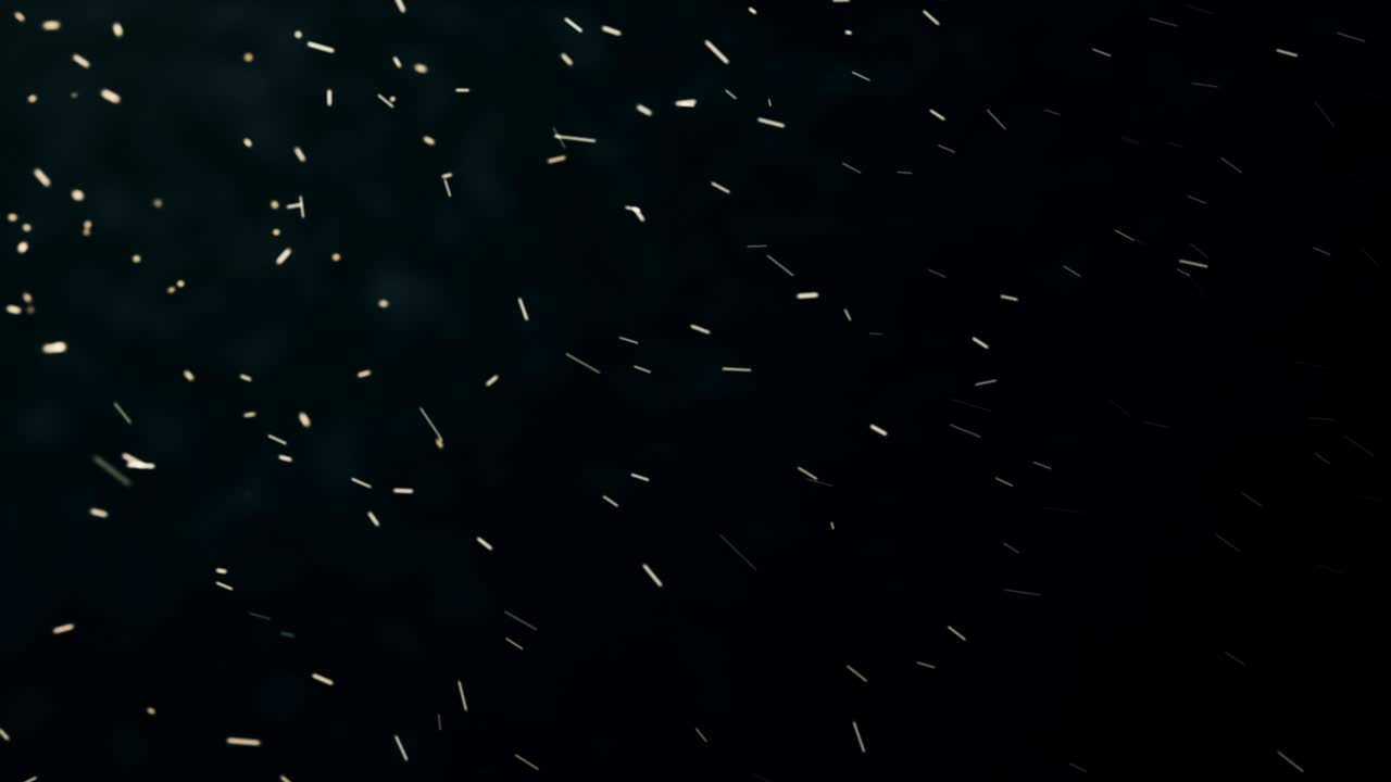 Abstract composition from chaotic flying sparkles like a snow in a winter with depth of field 4K