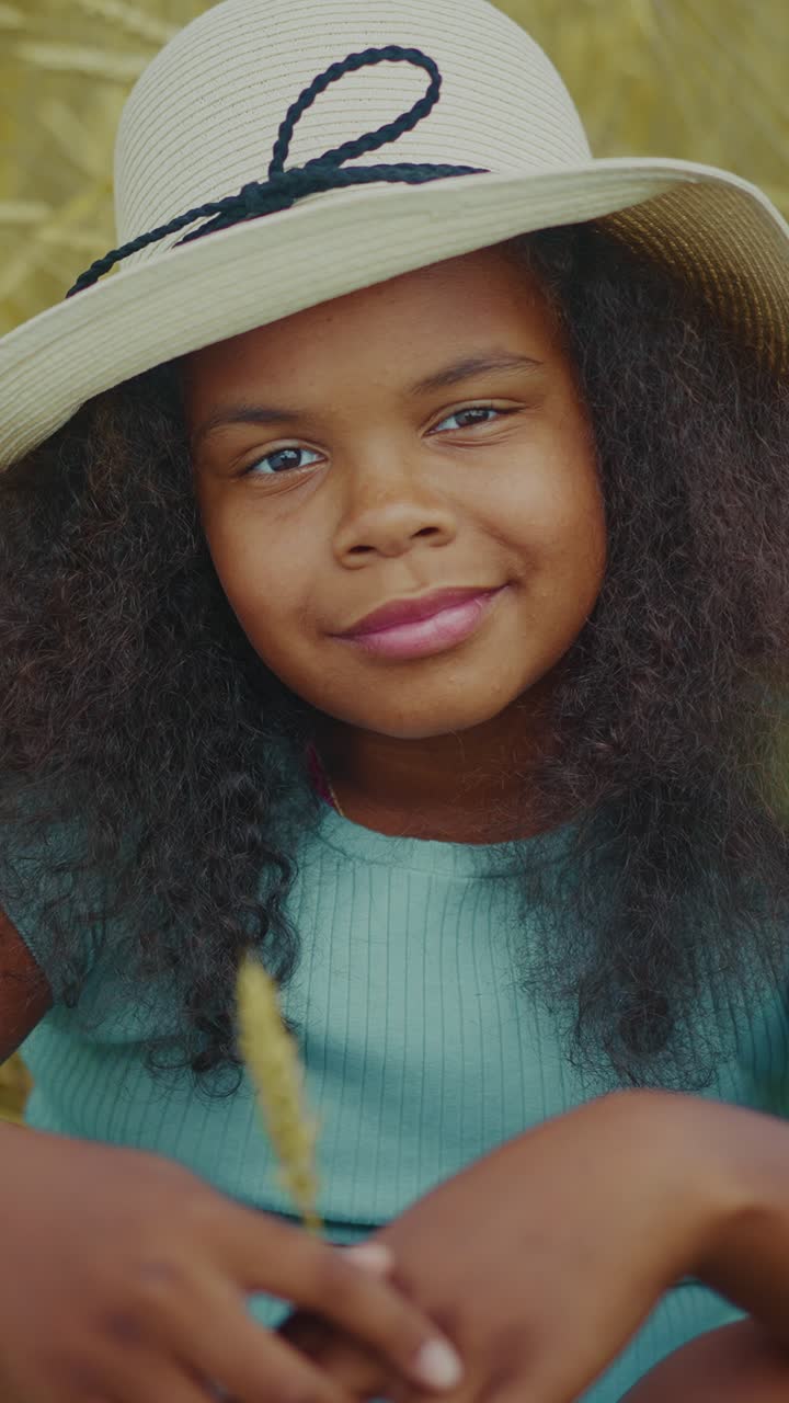Portrait of a girl in a straw hat