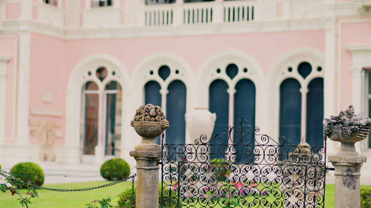Close up of a decorative stone pillar in the courtyard of Villa Ephrussi de Rothschild with a blurred view on the background