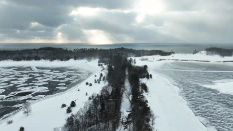 Inland-road-between-two-frozen-lakes-near-the-shores-of-Lake-Michigan