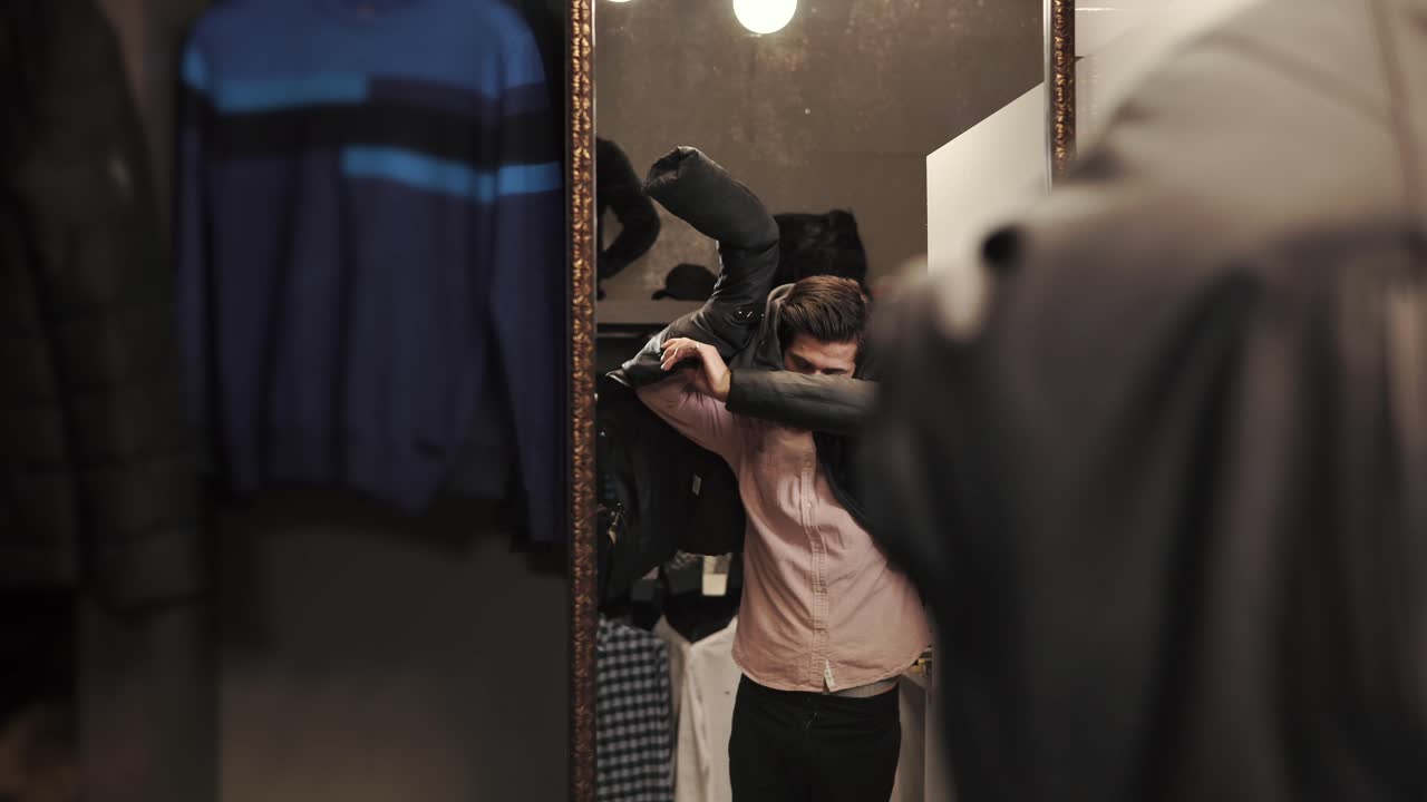 Man Trying On Clothes in a Fitting Room