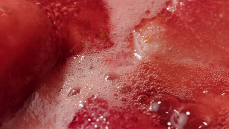 Close up of Strawberries in a Sparkling Beverage