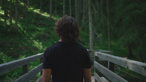 Young-Man-Walking-Through-the-Woods